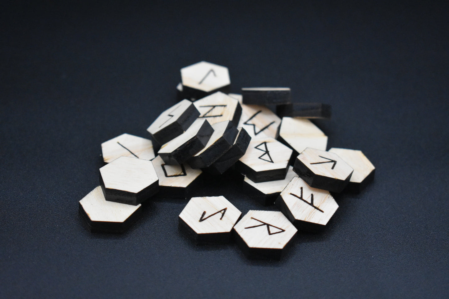 Product photo of laser cut hexagon ash runes