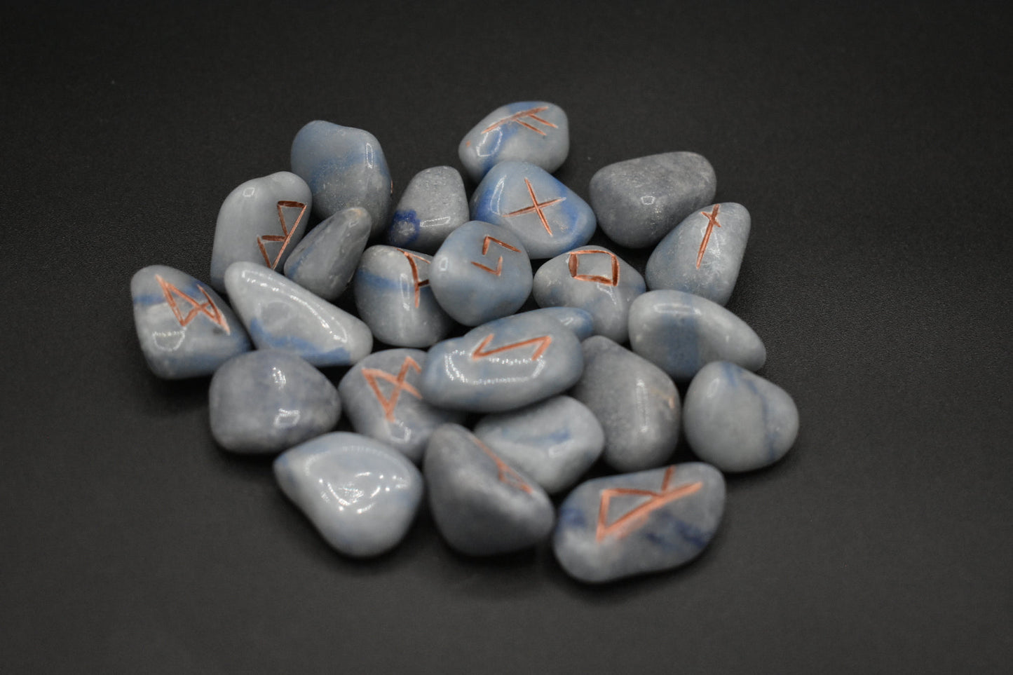 Product photo of blue aventurine elder futhark runes with copper inlay