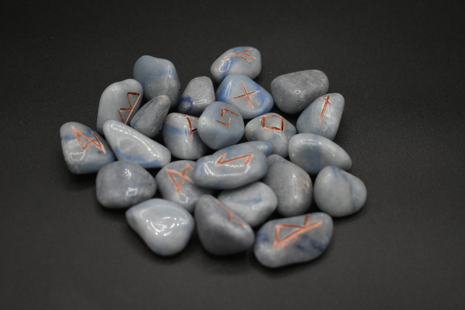 Product photo of blue aventurine elder futhark runes with copper inlay