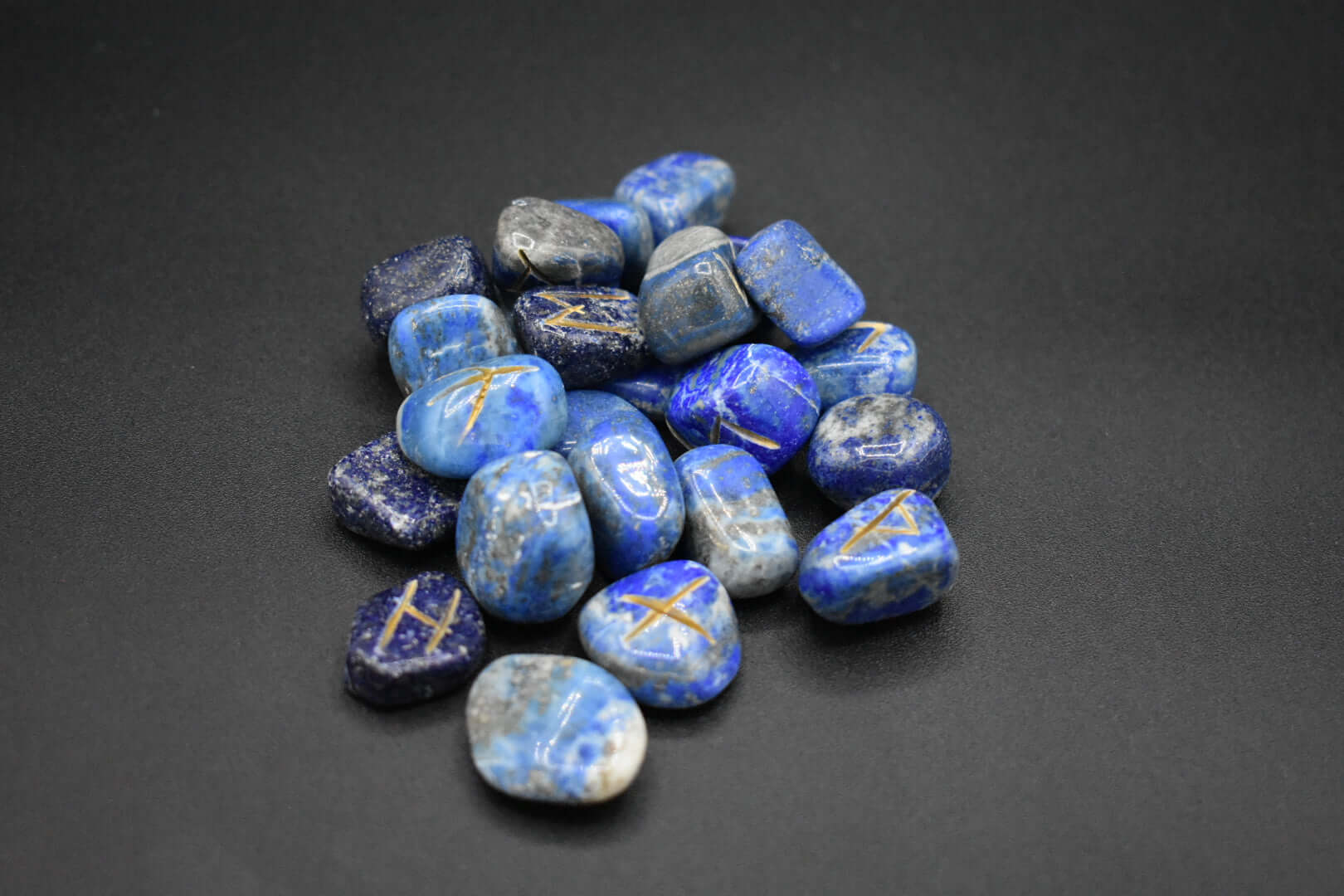 Product photo of lapis lazuli elder futhark runes with gold inlay