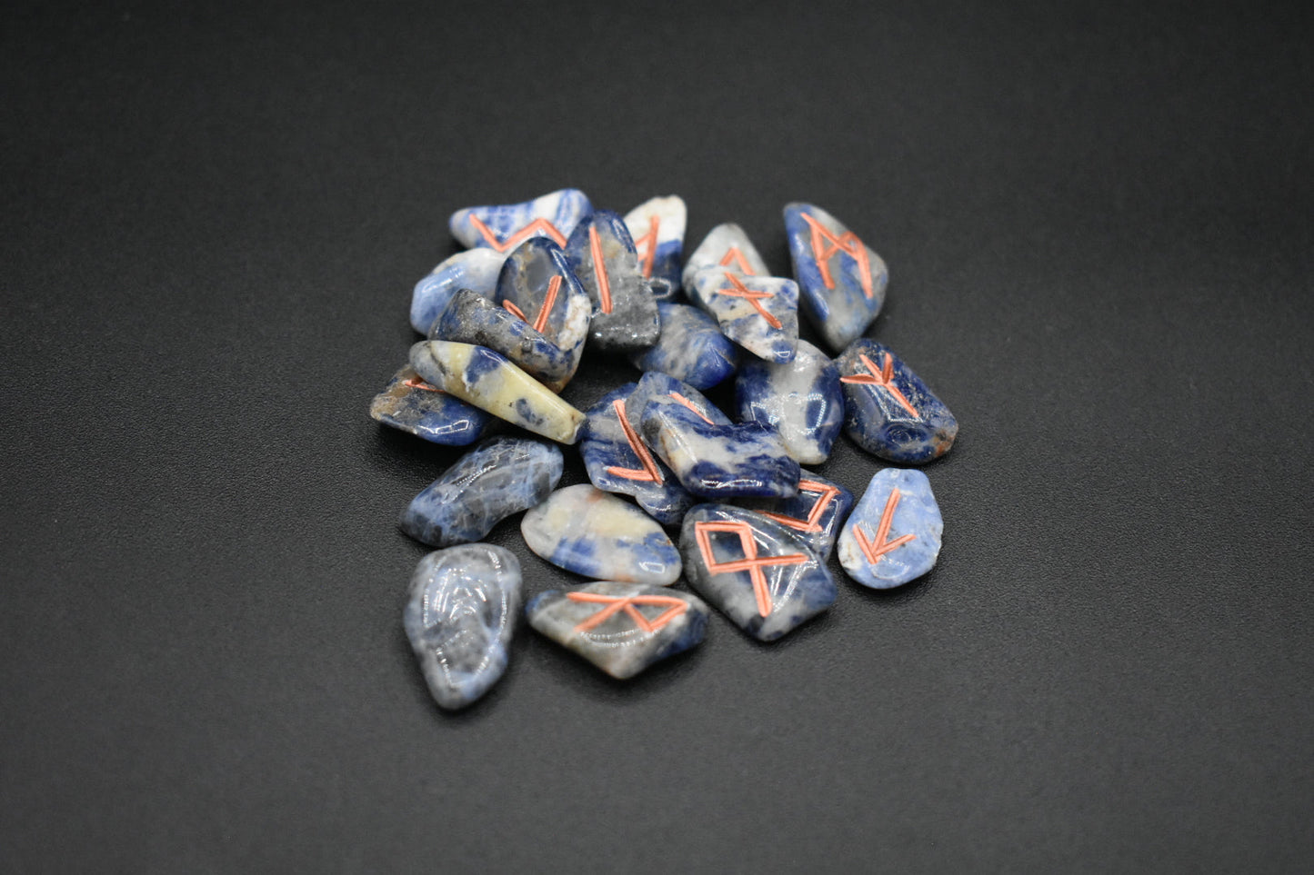 Product photo of mini sodalite elder futhark runes with copper inlay