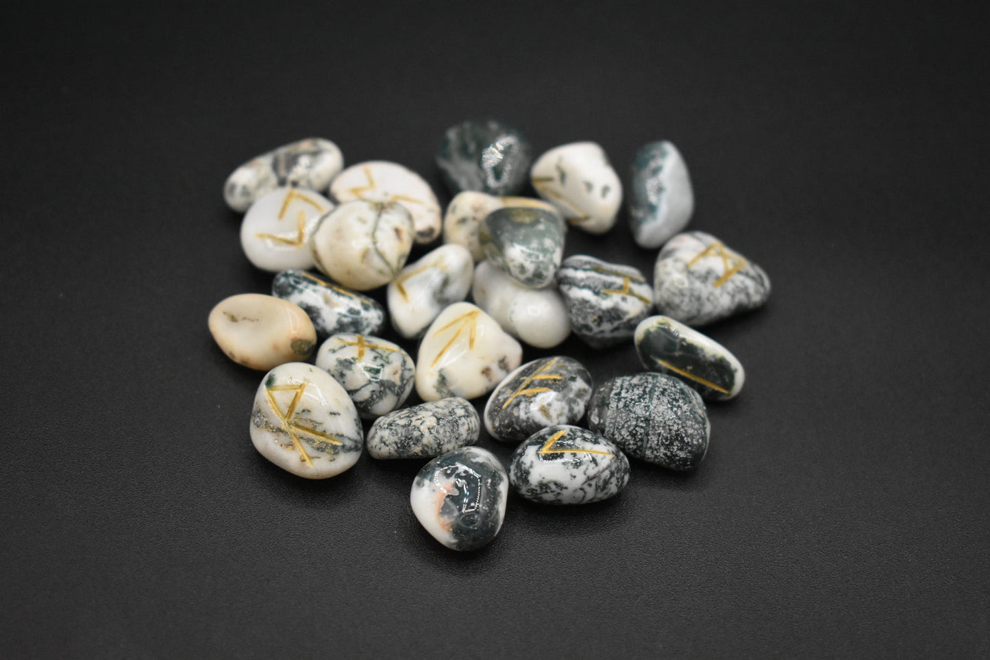 Product photo of moss agate elder futhark runes with gold inlay