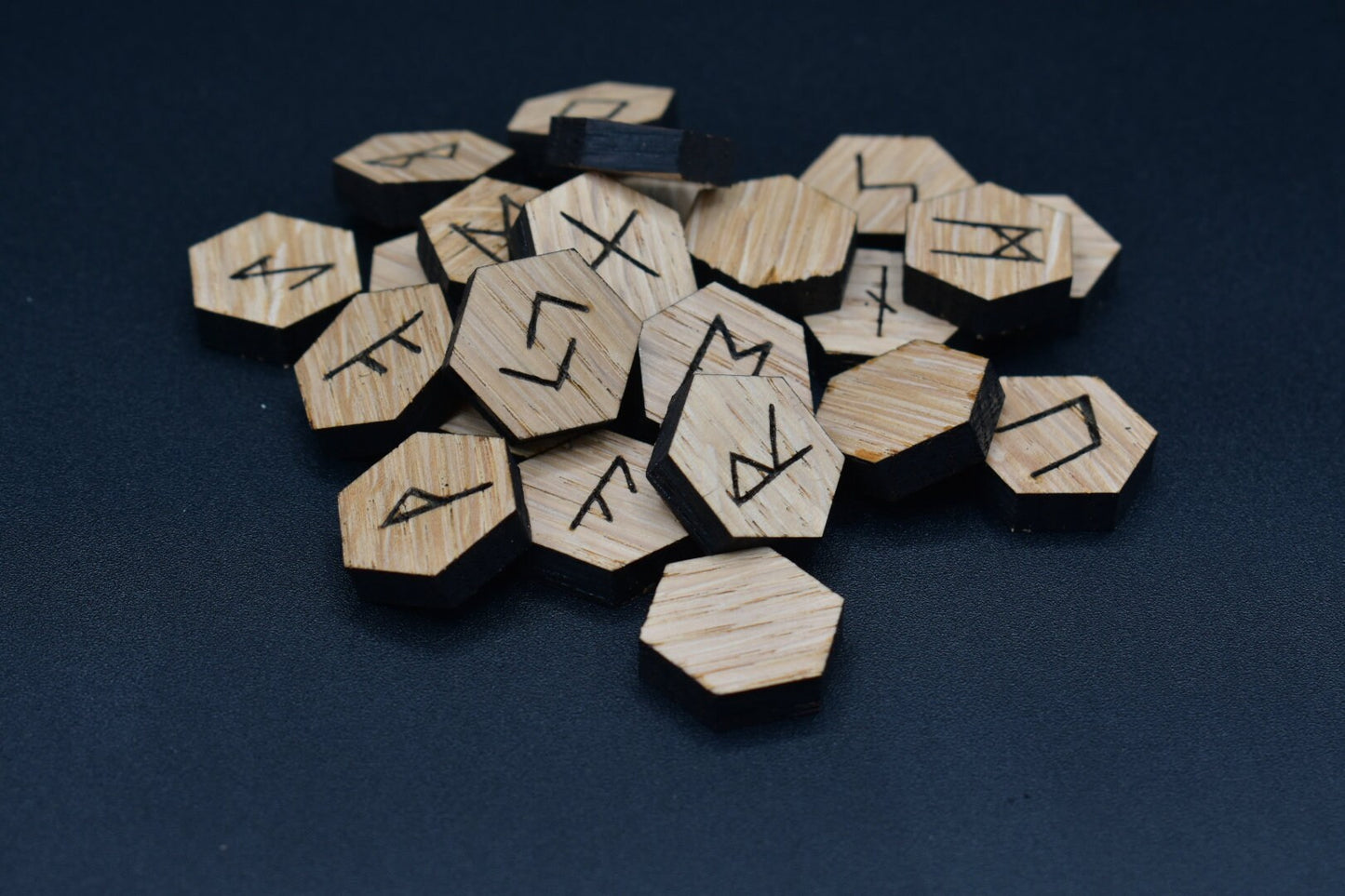 Product photo of laser cut hexagon oak runes