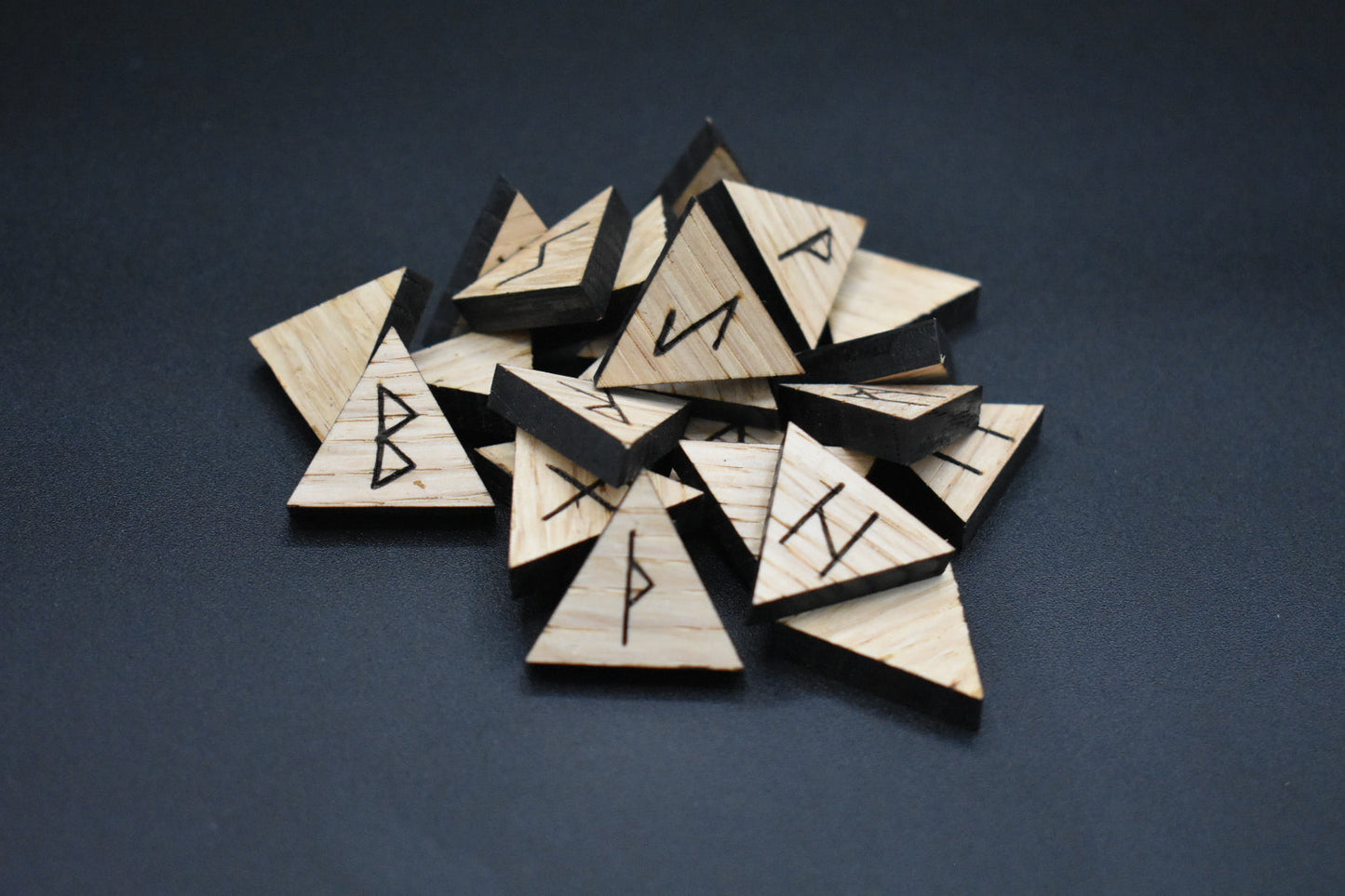 Product photo of laser cut triangle oak runes